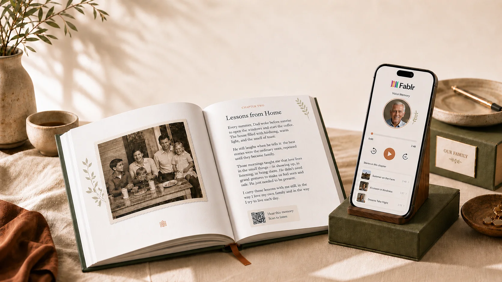 The finished hardcover open beside a phone playing the chapter in the storyteller's own voice